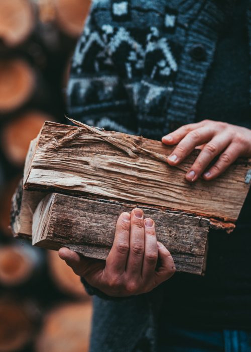 Man,Hands,Holding,Firewood.,Unrecognizable,Male,Caring,Wood,Logs,To